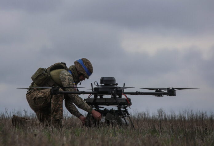 Ukrainian serviceman prepares for a flight a heavy drone near a front line in Donetsk region